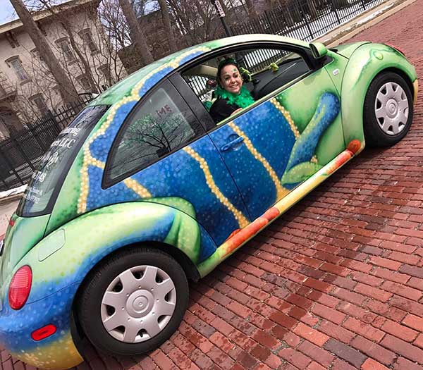 Artisan Hearing Technologies LLC out in the community in their frog car. 